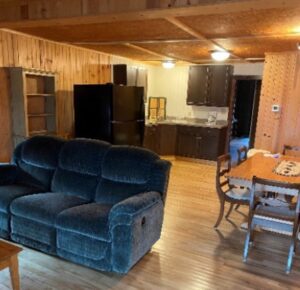 A living room with a couch and a table