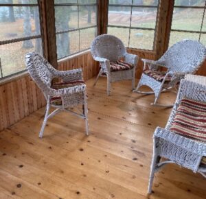 A room with four chairs and two benches.