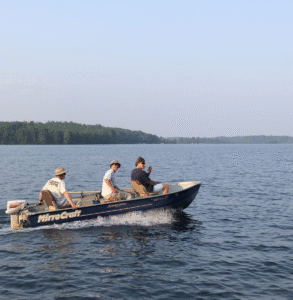 people riding in boat high lake musky lodge boulder junction Wisconsin